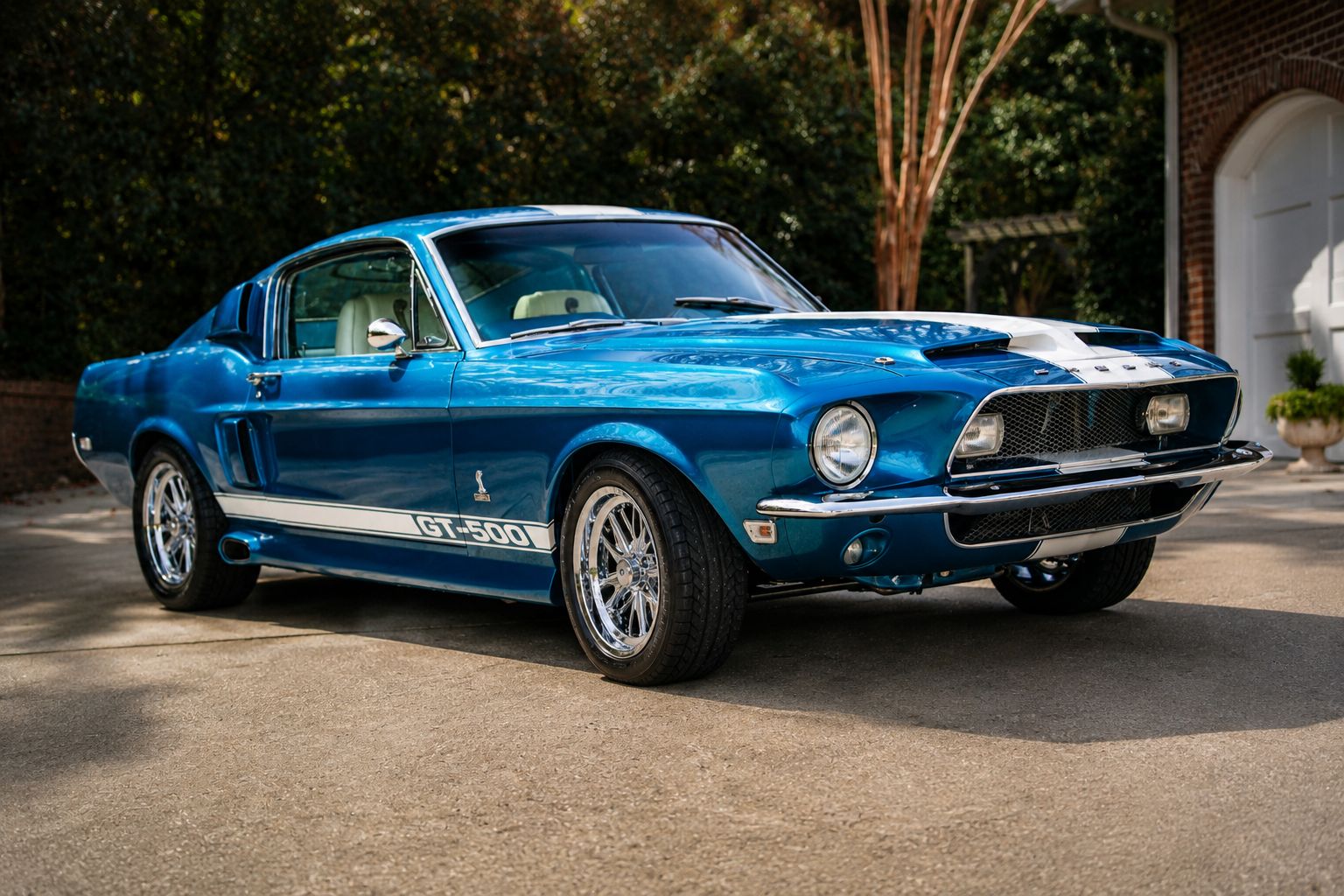 Blue classic Shelby GT500 Mustang with white racing stripes